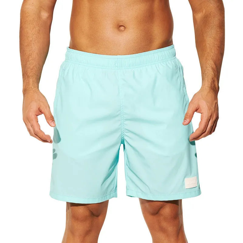 Men's quick-drying nylon shorts in solid colours with straight leg opening for beach and sports