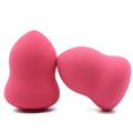 Pink teardrop makeup blending sponge on a plain background.