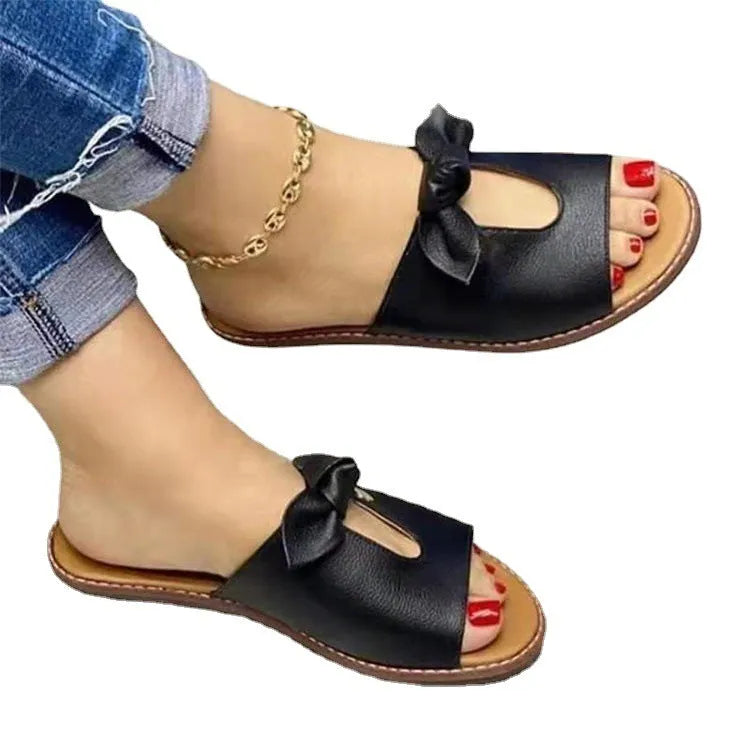 Women's black fish mouth sandals with a bow detail on the artificial PU upper and a rubber sole.