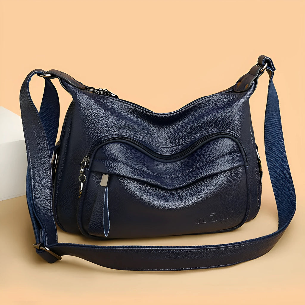 Large black PU shoulder bag with crossbody strap showing multiple internal compartments and zipper closure