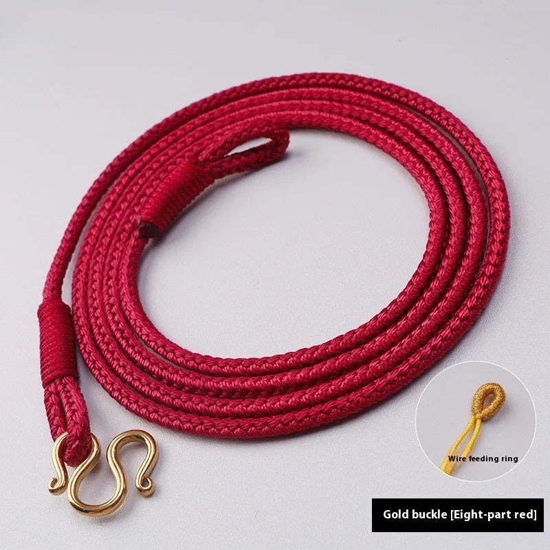 Gold peace buckle choker necklace with intricate mixed gemstone inlaid pendant on a model.