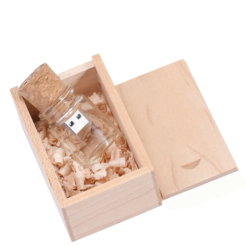 Personalised wooden drift bottle-shaped USB flash drive showing custom graphic on its side.