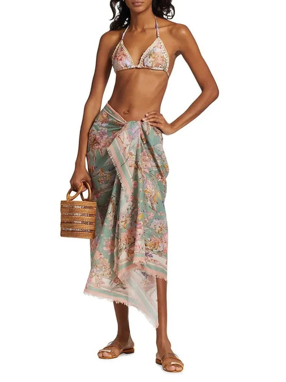 Women's creamy white floral print bikini set with matching skirt for swimming