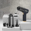 Black wireless handheld vacuum cleaner with multiple attachment nozzles for car and home cleaning