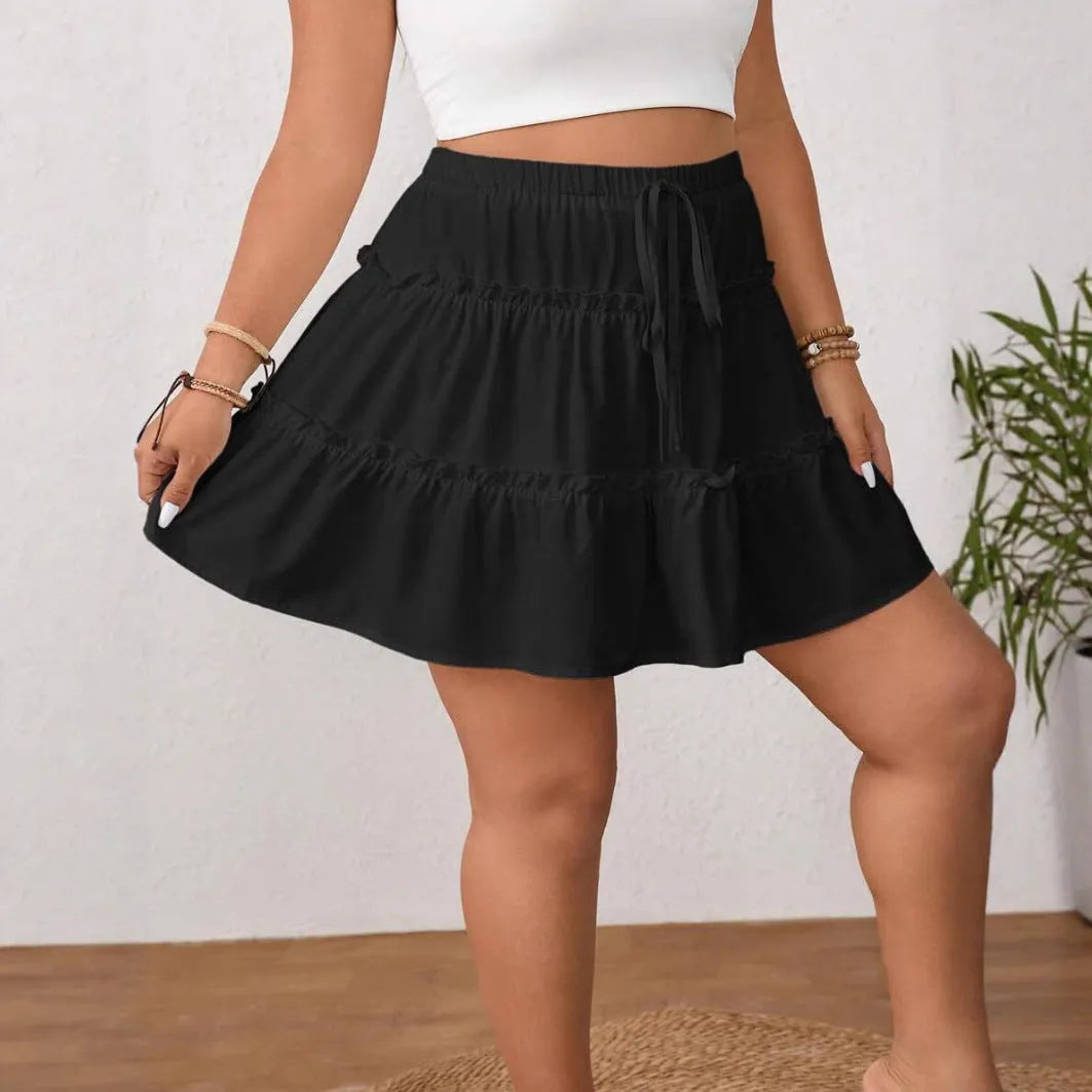 Women's white pleated A-line short skirt with lace-up front closure detail