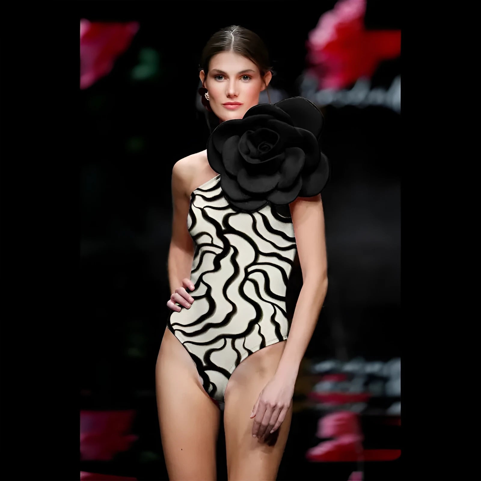 One-piece swimsuit with raised three-dimensional floral pattern in a solid colour, showing a tight European/American style fit.