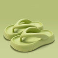 Solid colour thick-soled flip flops with decorative bow and injection moulded EVA construction