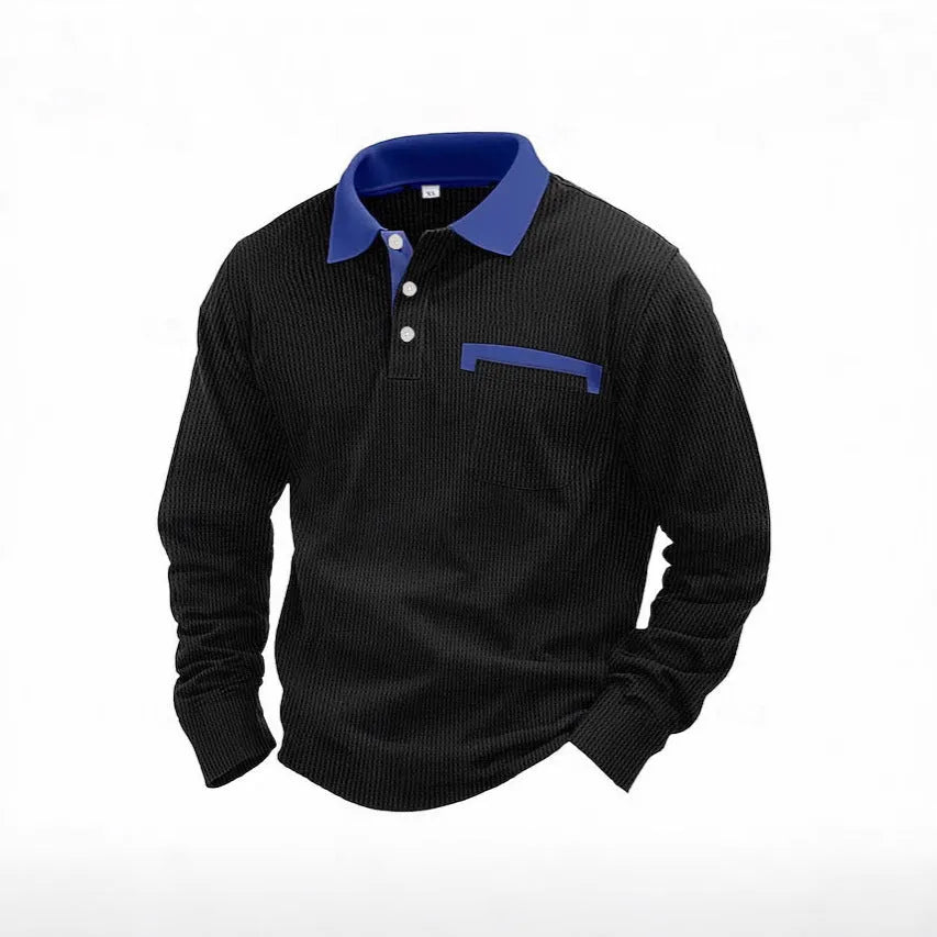 Man modelling a loose-fit long-sleeved waffle-knit polo shirt in a solid colour with an asymmetrical style detail.