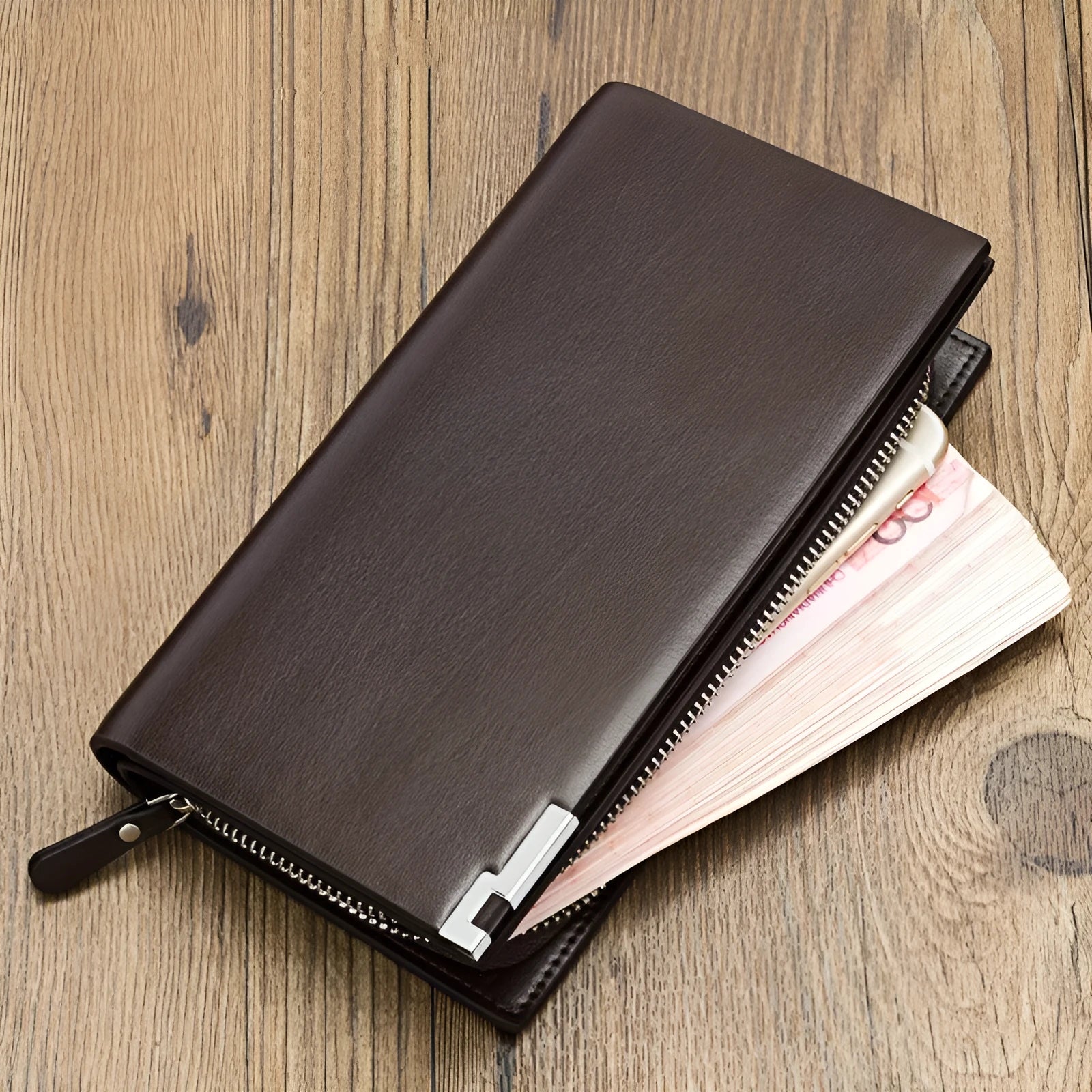 Men's long black PU leather wallet with a silver zipper closure laid flat.