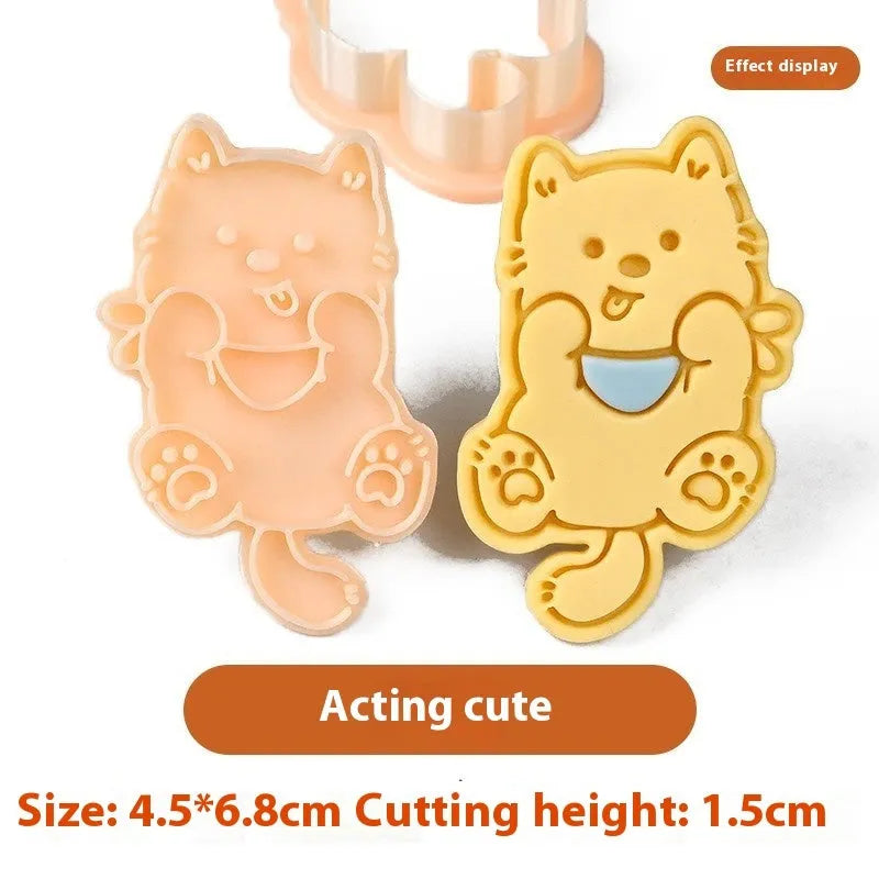 Three dimensional plastic biscuit mold showing puppy head and birthday hat designs