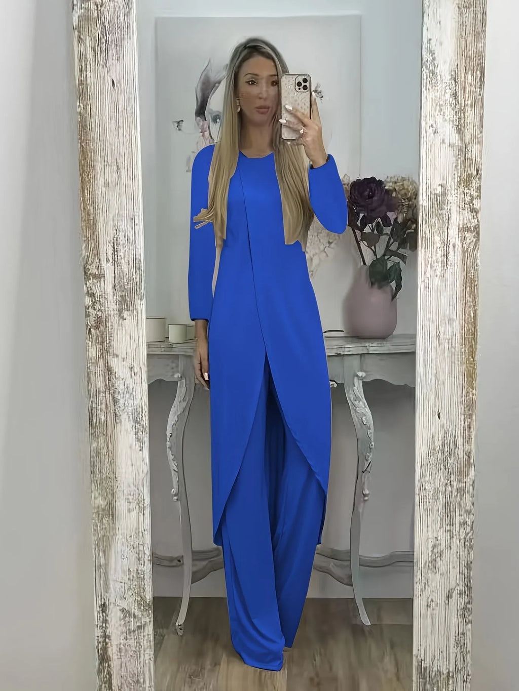 Casual loose-fitting long sleeve top and trousers lounge set in polyester.
