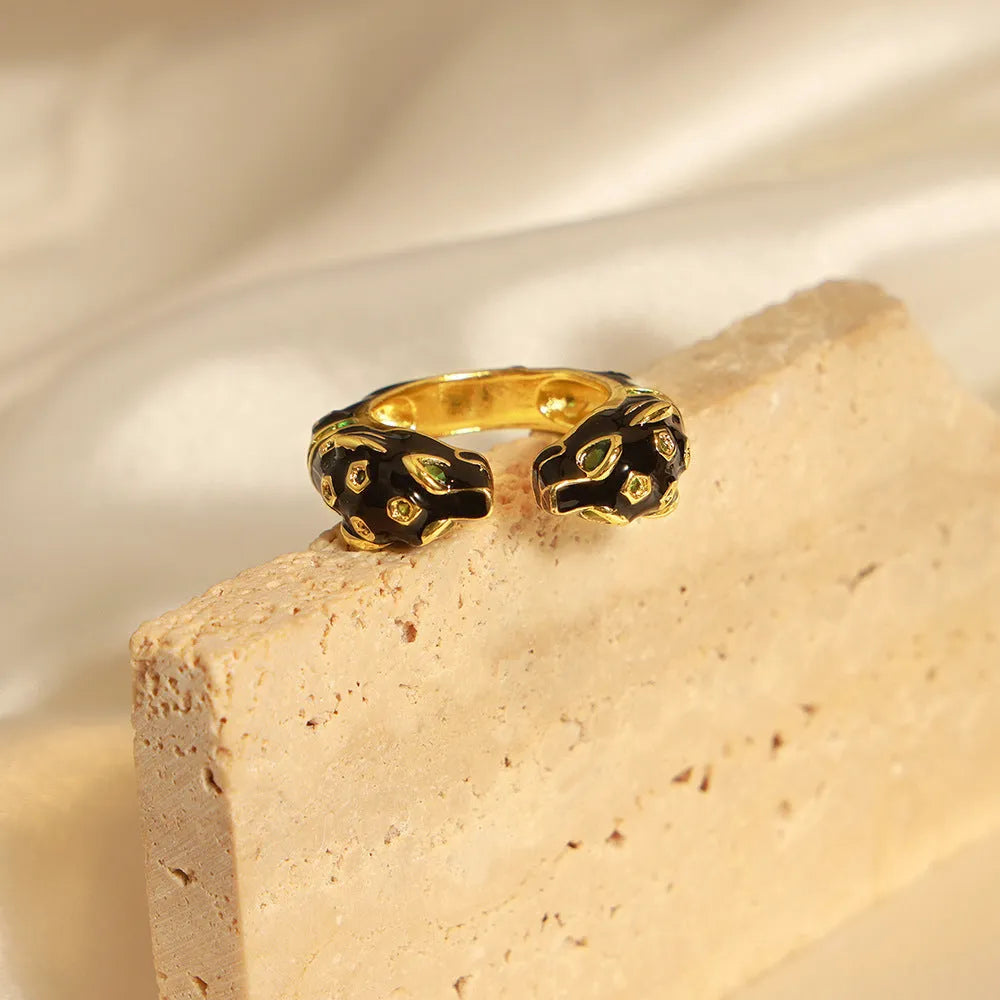 Geometric open copper ring for women with black cheetah print, size 7.