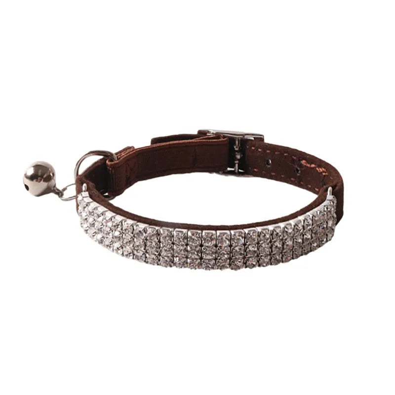 Soft pink flocking cat collar with silver elastic buckle, shown adjusted to fit.