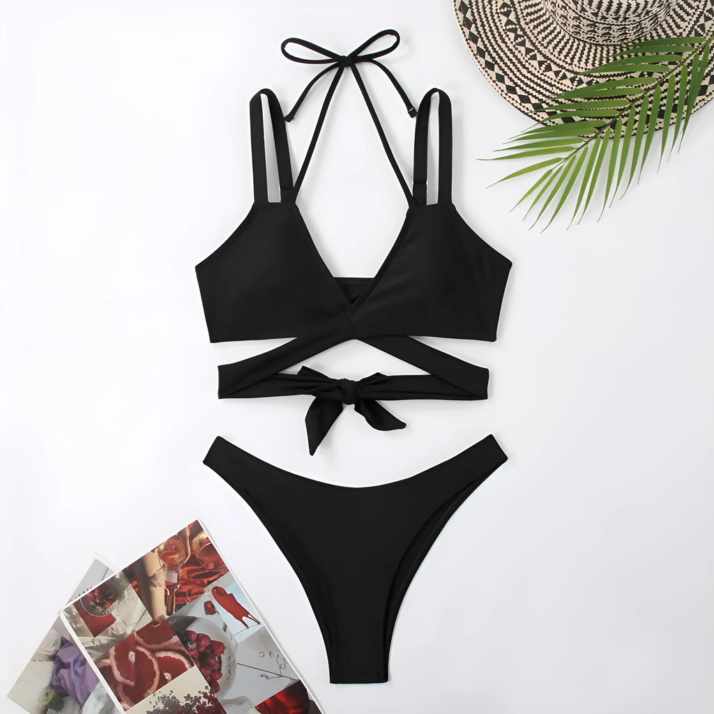 Women's solid colour strap beach bikini swimsuit in a briefs style, shown in one of five colour options.