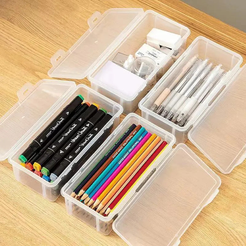 Large clear plastic stationery storage box filled with coloured pencils and wax crayons
