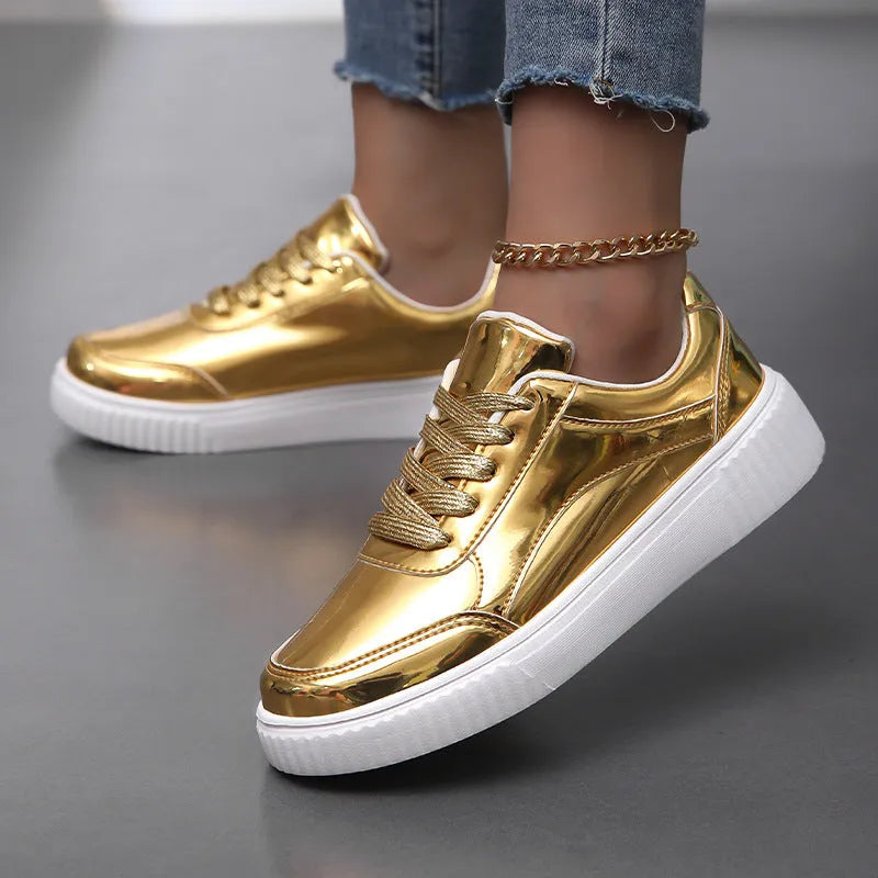 Rose gold sequinned platform sneakers with round toe and thick sole on a white background