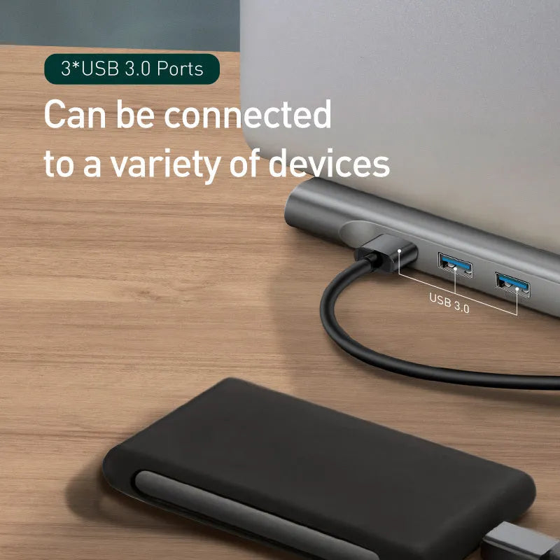 Grey aluminium USB C docking station with ten ports and an integrated laptop cooling bracket.