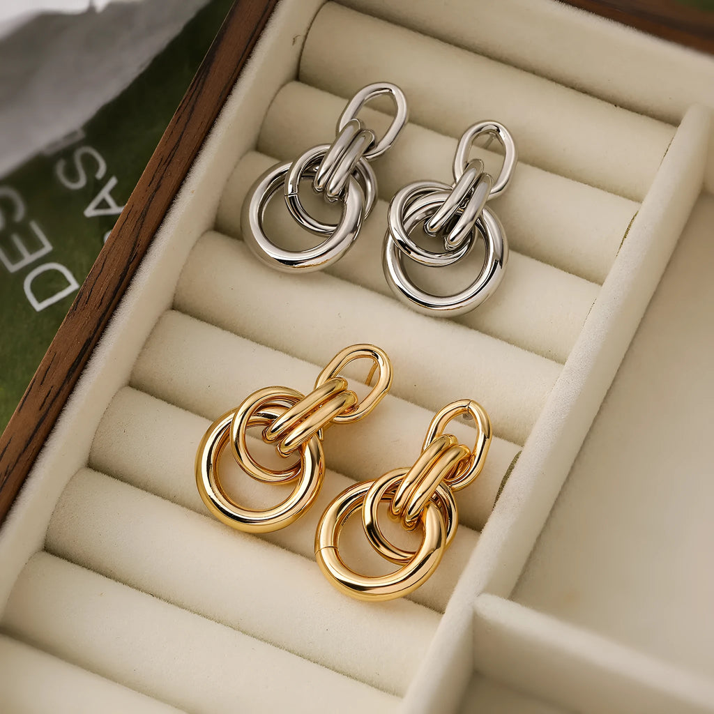 Gold geometric copper earrings with irregular shape and simple pierced design