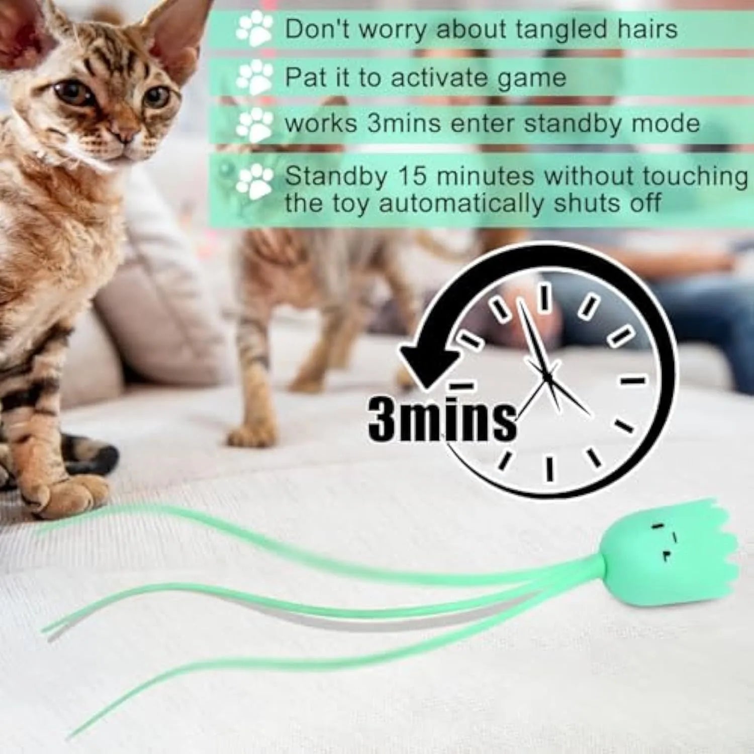 Green electronic cat toy with swinging silicone tail on floor for indoor cat play