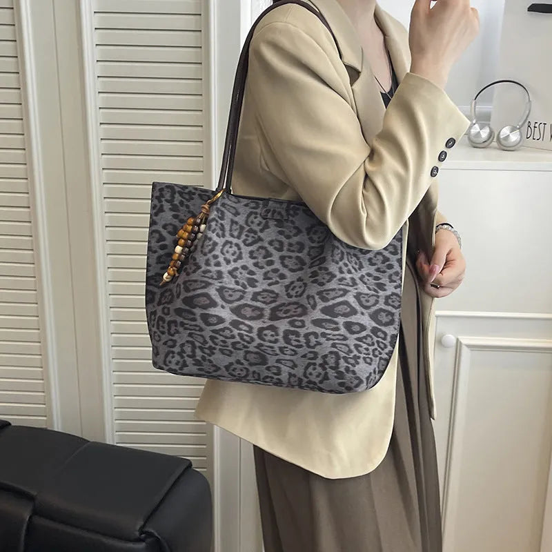 Leopard print polyester hand-held tote bag with double shoulder straps on a white background