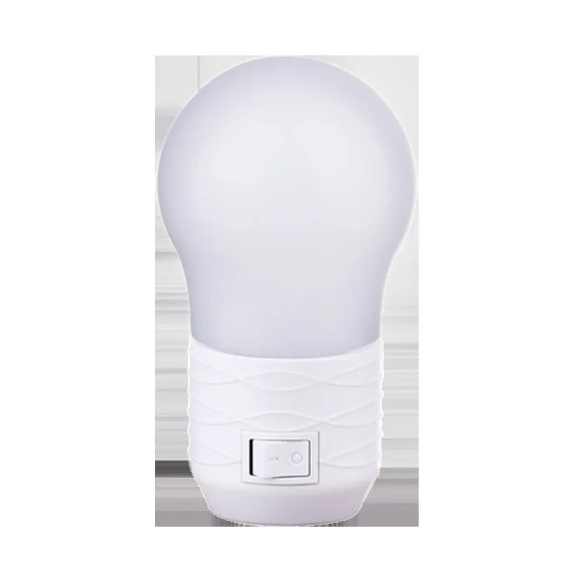 Plug-in bedside baby night light in white, blue or pink with round modern design