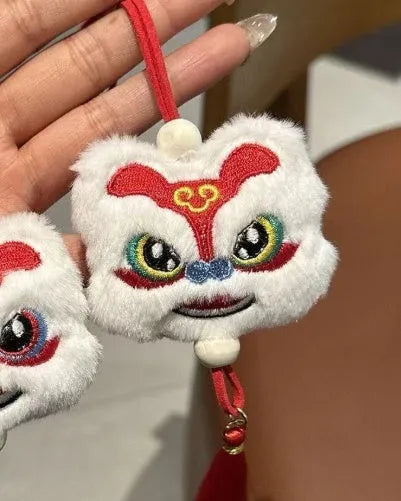 Chinese style plush lion tassel keychain ornament with star stone detail in blue or yellow