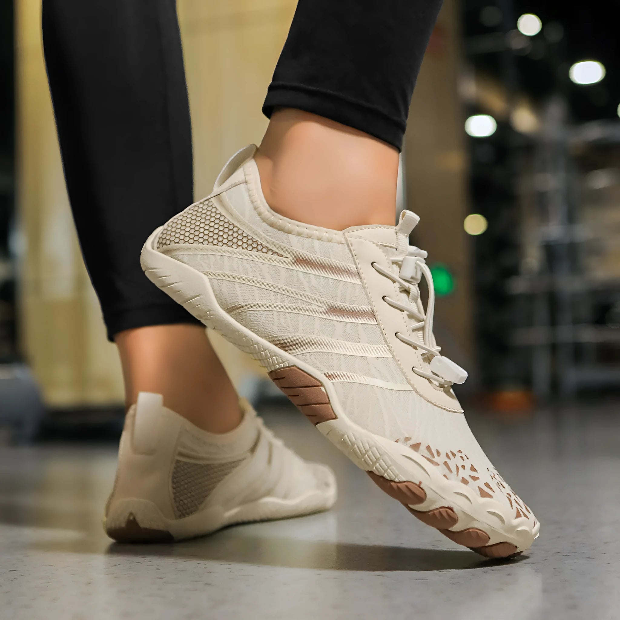 Unisex casual beach running shoes with Lycra stretch fabric uppers in beige colour.