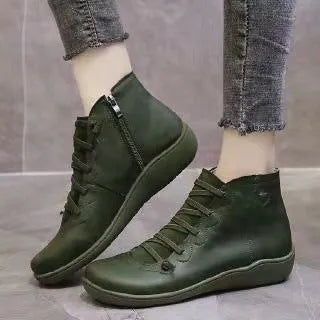Women's flat wedge heel ankle booties in various colours including leopard print, with round toe and rubber sole.