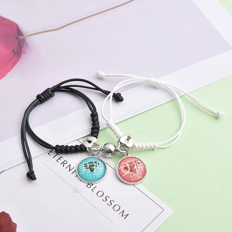 Pair of alloy suction bracelets with engraved symbol choices including crown, love lock, and clover.