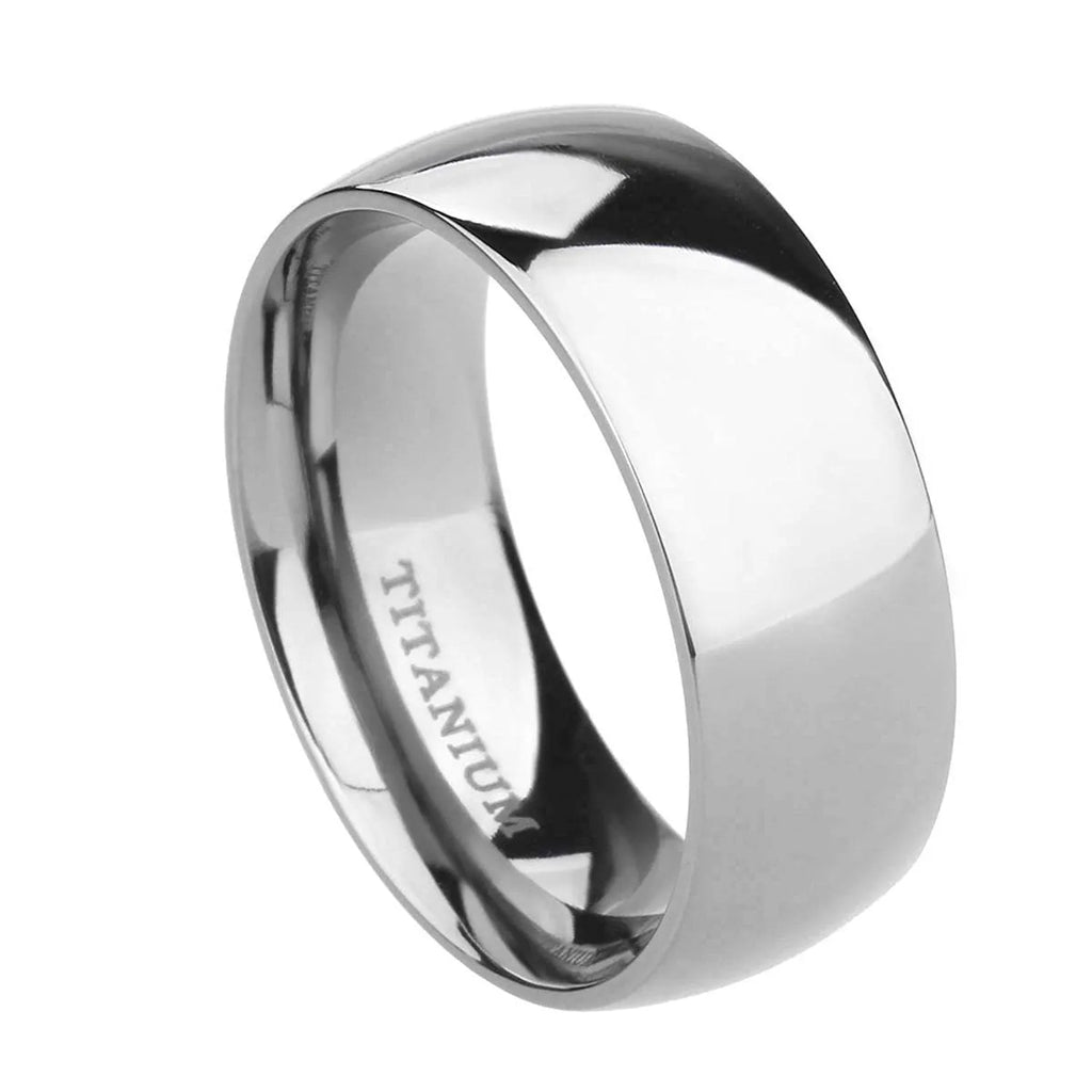 Polished silver titanium steel ring on a finger, showing a minimalist band design.