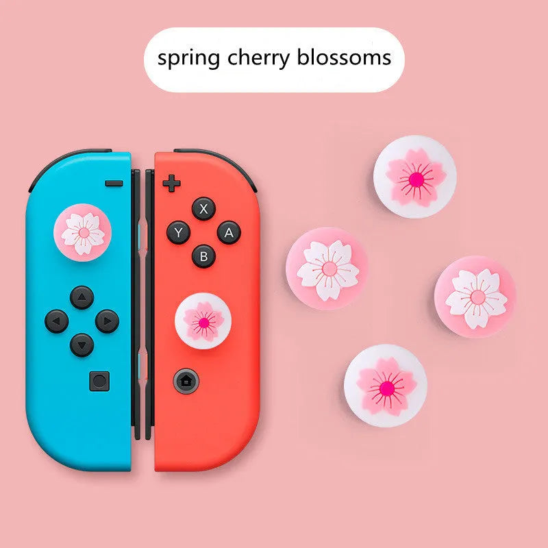 Four silicone rocker caps for Nintendo consoles in various colour combinations