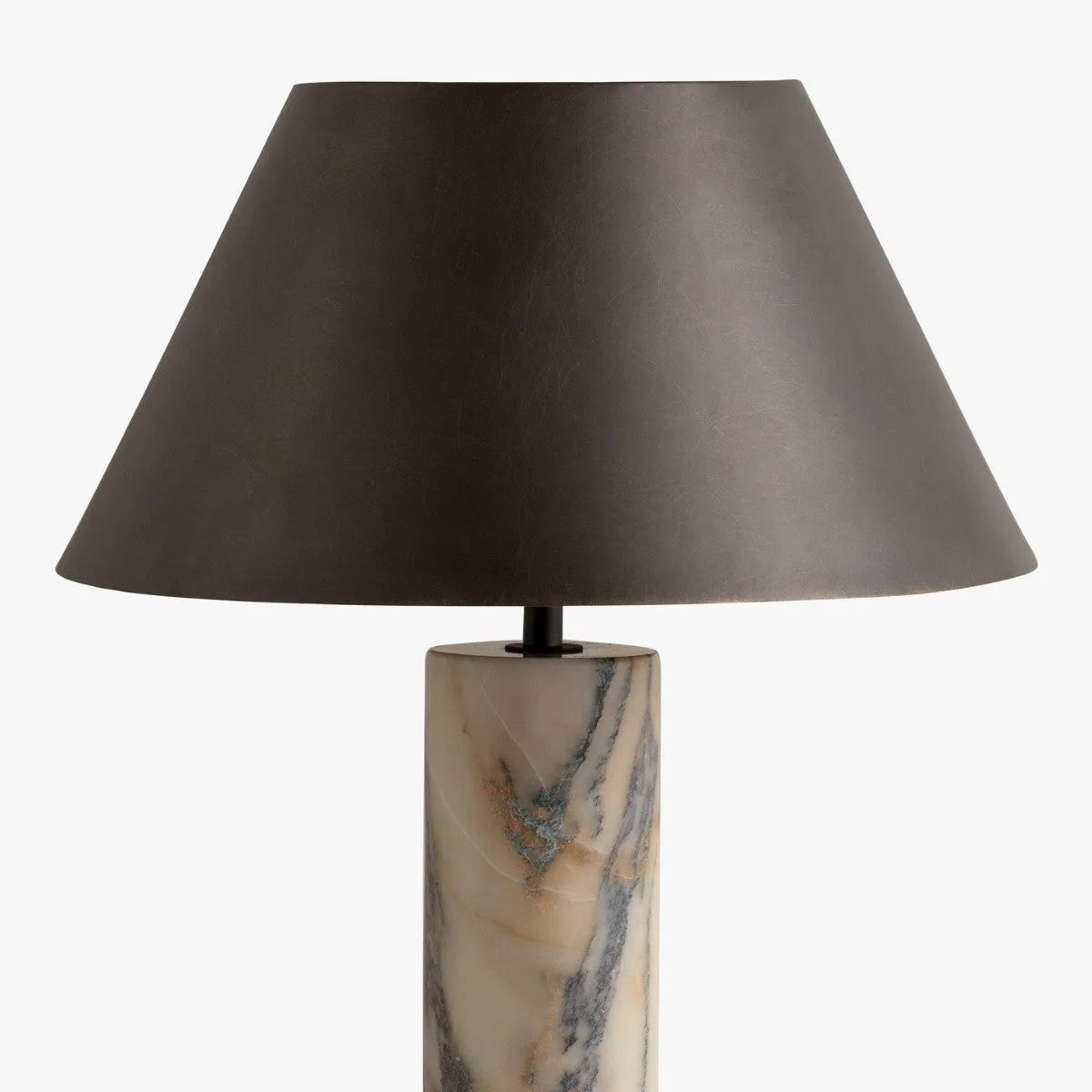 Black modern table lamp with a marble base on a wooden desk.