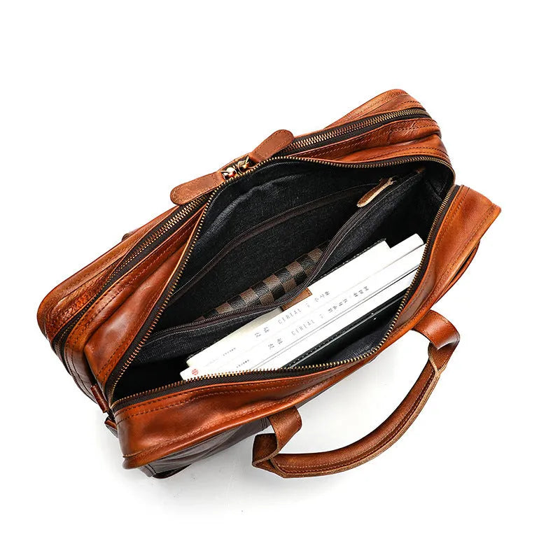 Men's black leather briefcase showing interior organisational pockets and compartments