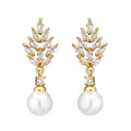 Geometric flower earrings with zircon stones and pearl accents in gold, white gold, or rose gold plating