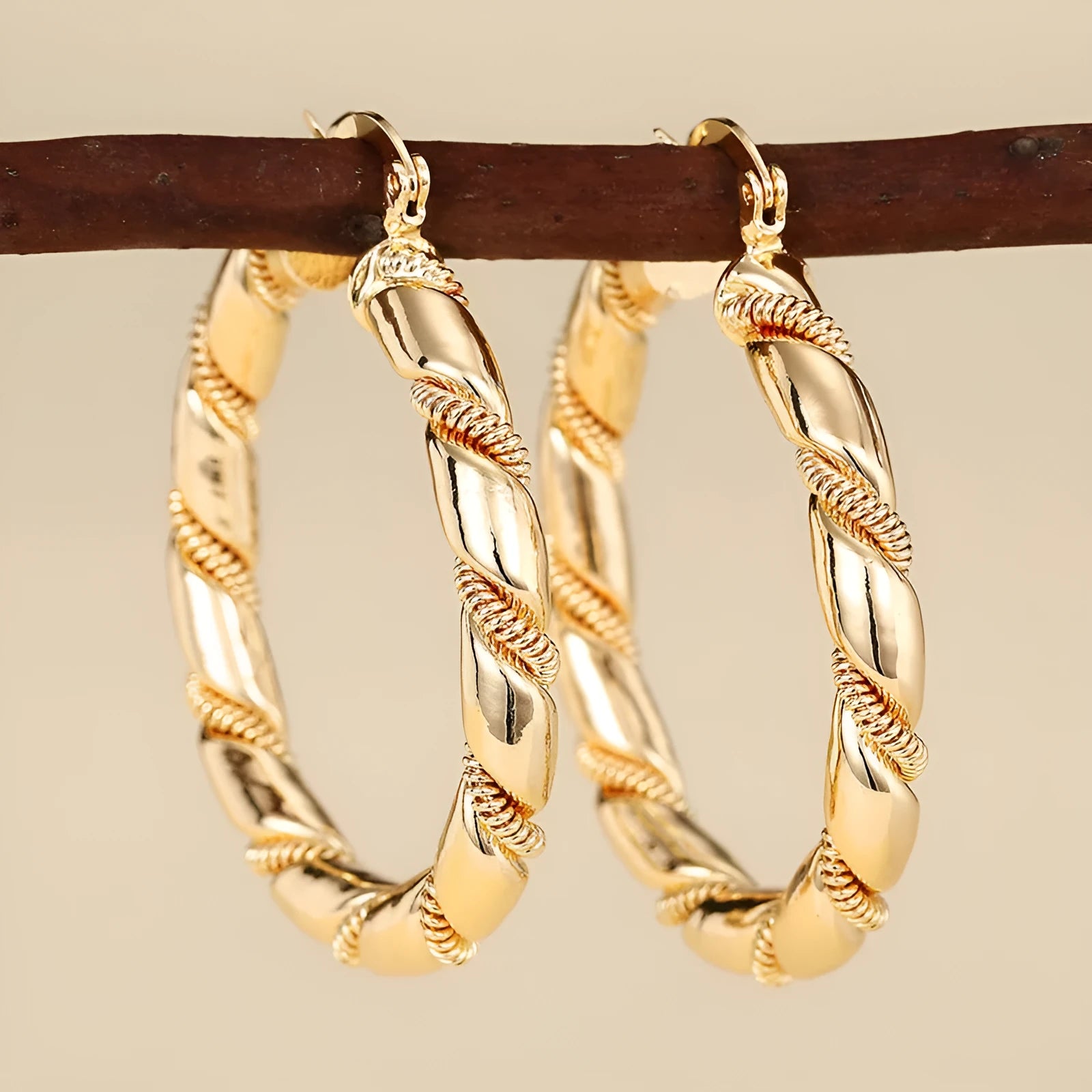 Geometric copper earrings with ring and line design in golden colour on ear