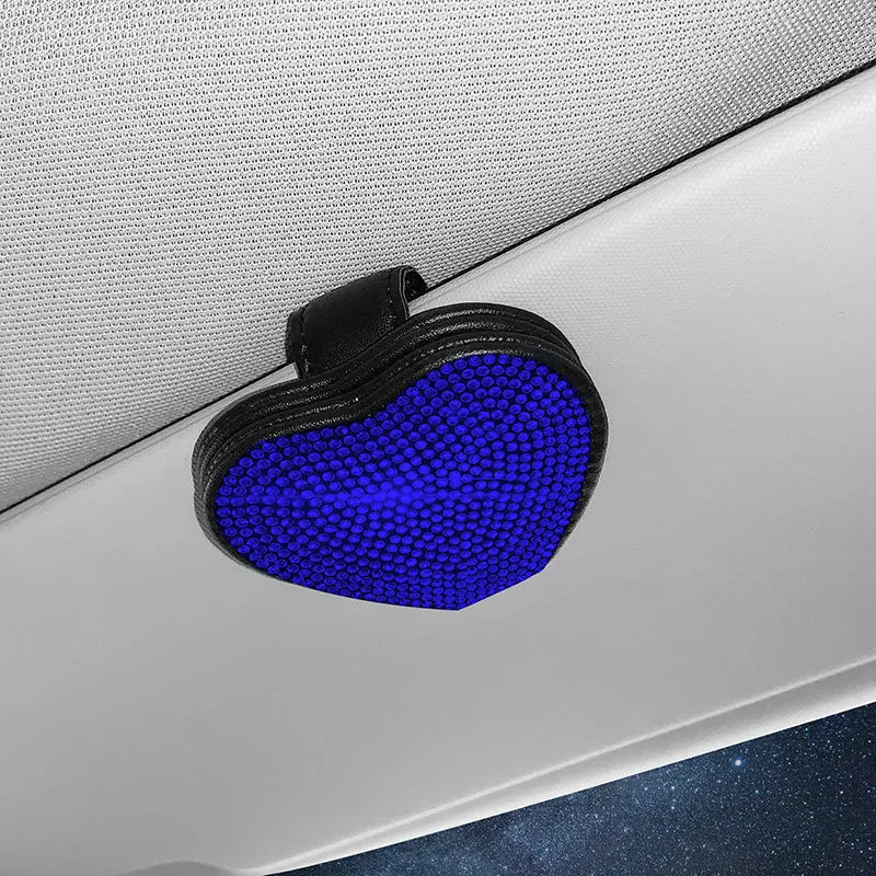 Black diamond-encrusted PU leather magnetic storage clip for car sun visor, holding sunglasses.