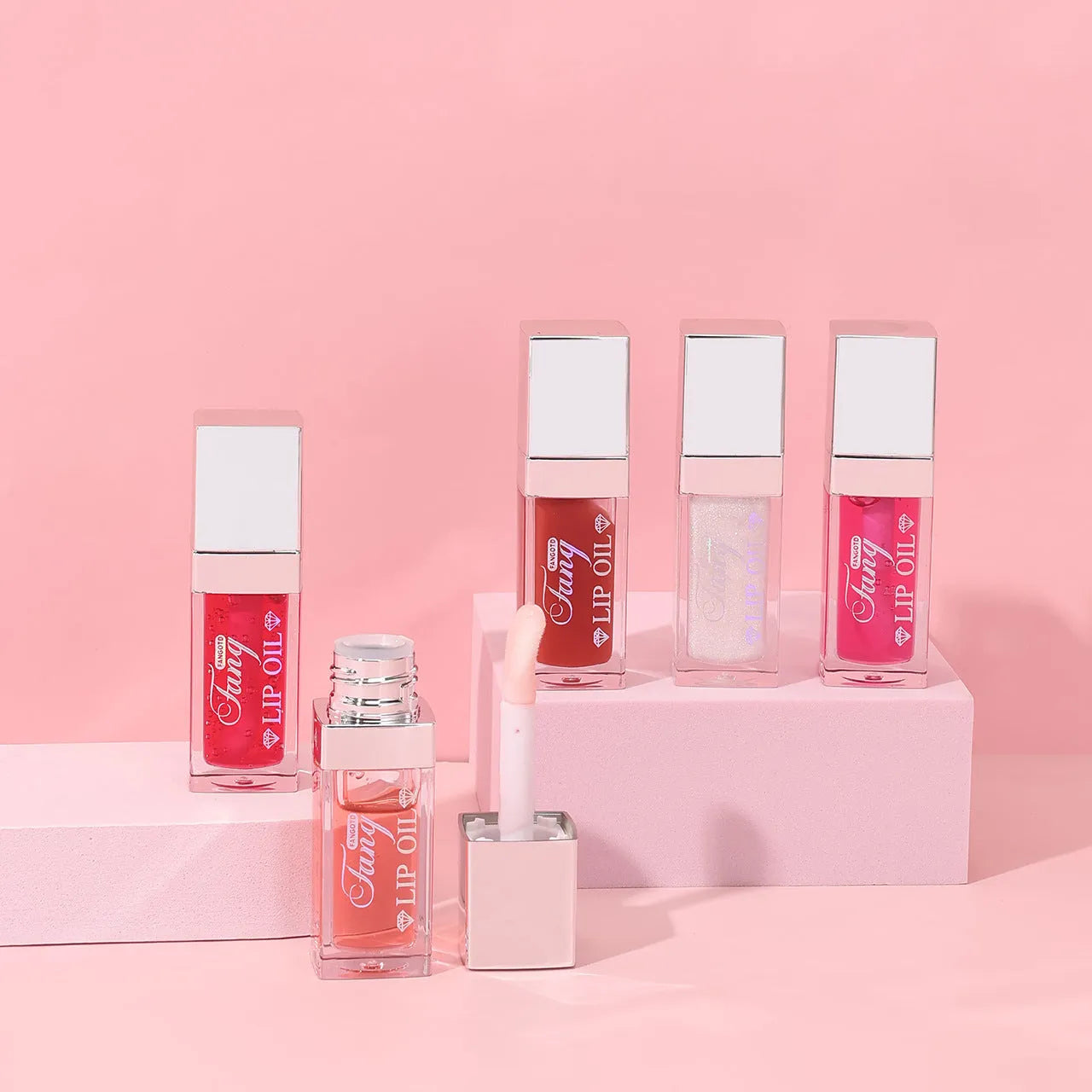 Five colour options of bright lip gloss mint lipstick with moisturising lip essence oil applicator