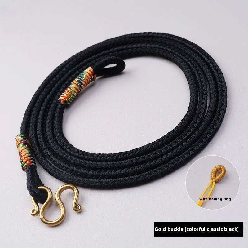 Gold peace buckle choker necklace with intricate mixed gemstone inlaid pendant on a model.