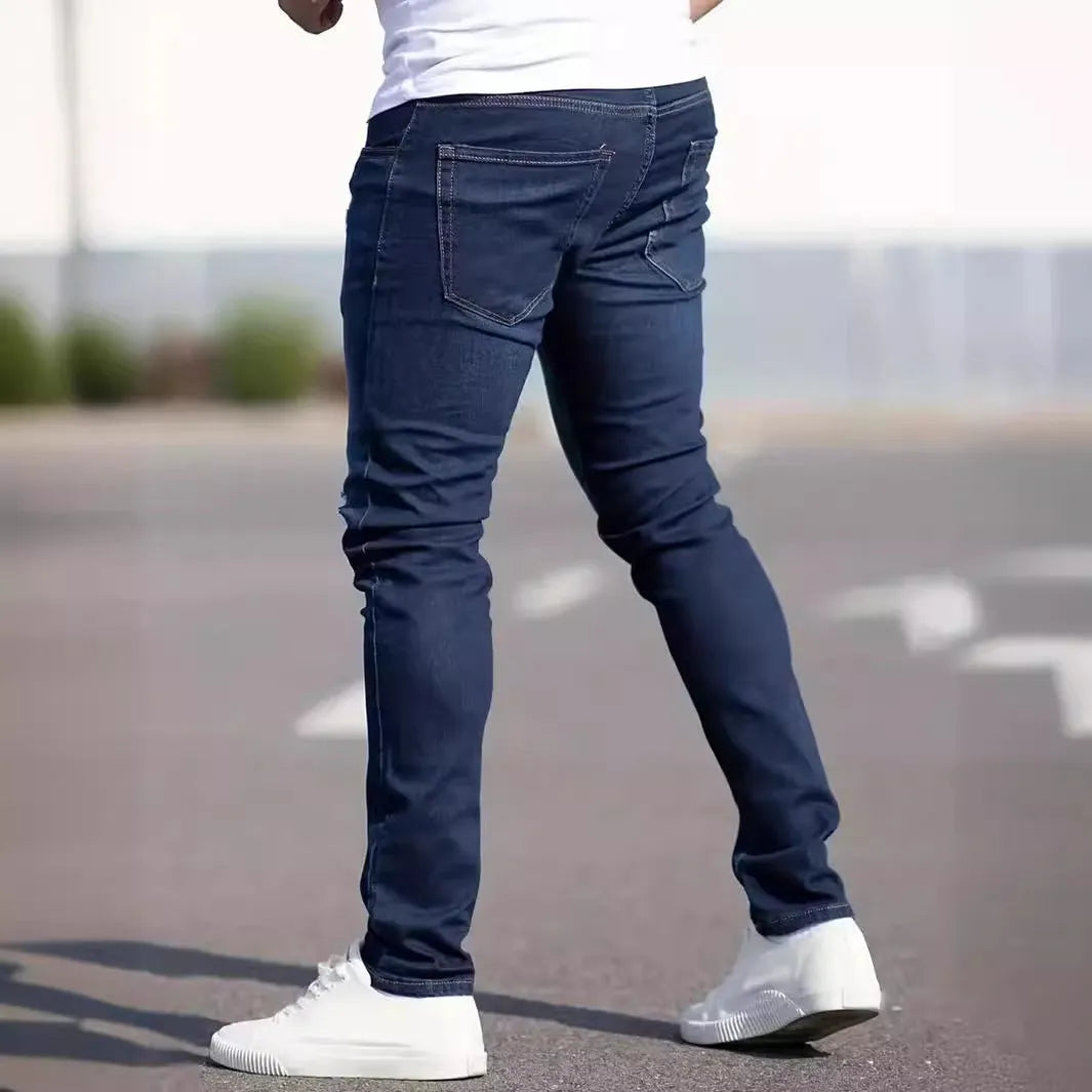 Men's slim fit dark blue jeans with skinny leg design and mid waist cut