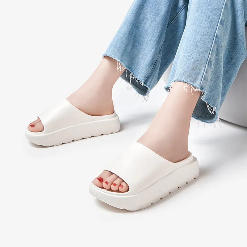 Women's beige thick-soled slippers with fish mouth pattern on 5.5cm EVA sole.