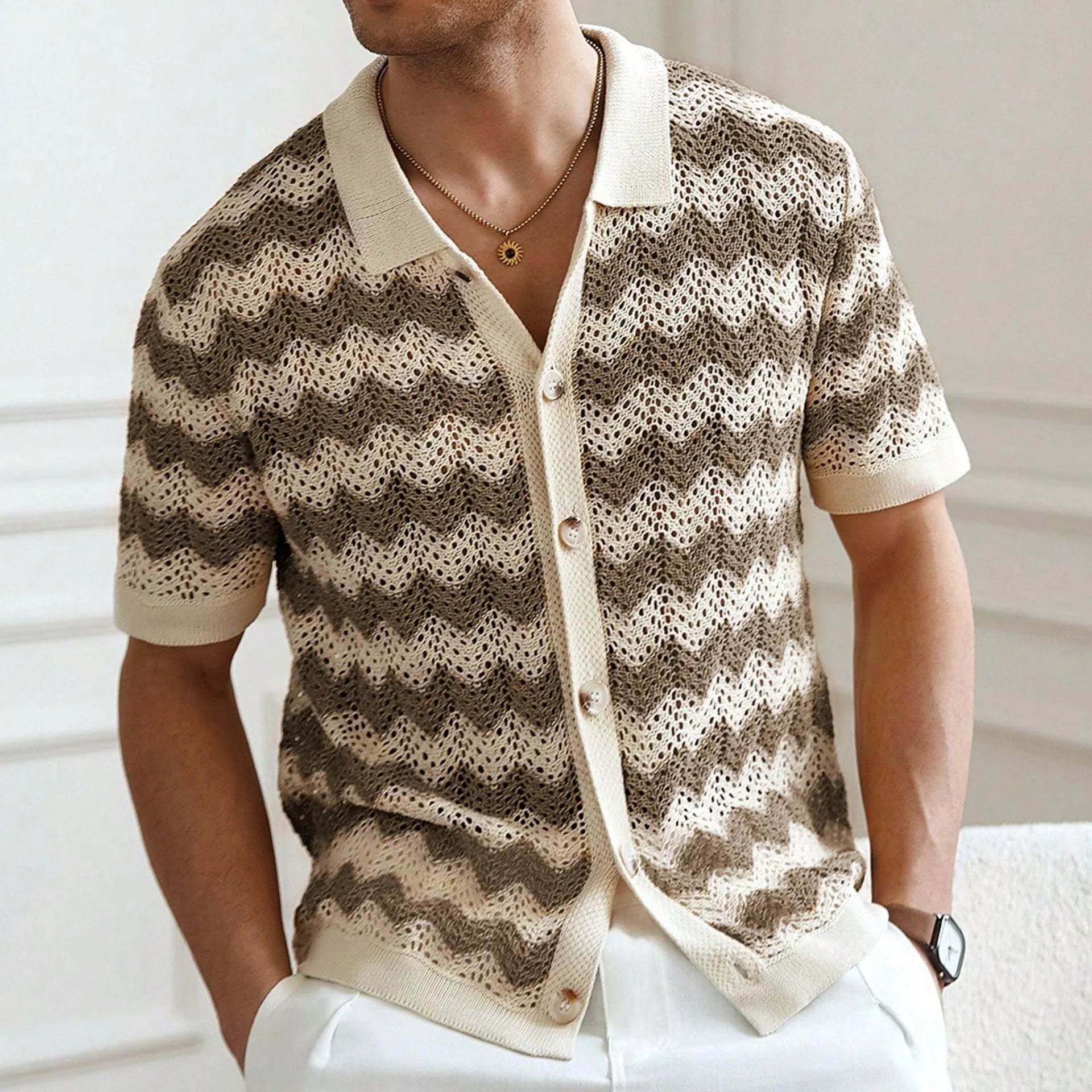 Short-sleeved yellow hollow jacquard corrugated sweater with flocked detail on a mannequin.
