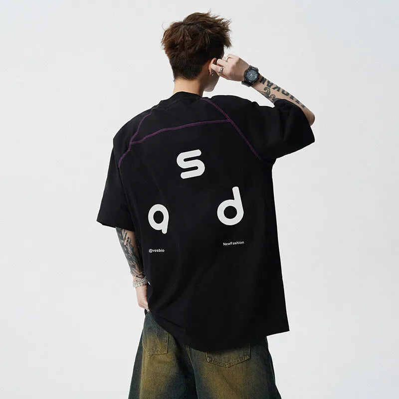 Men's loose fit black cotton t-shirt with a letter print on the front, short sleeves, and a round neck.
