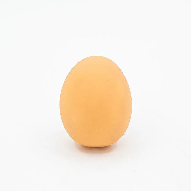 Egg-shaped dog squeaky toy for dental cleaning with sound mechanism
