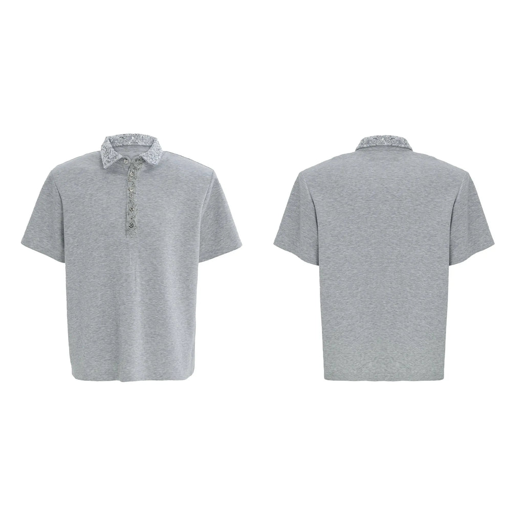 Men's black loose fit polo shirt with square collar and embroidery sequin details on sleeve.