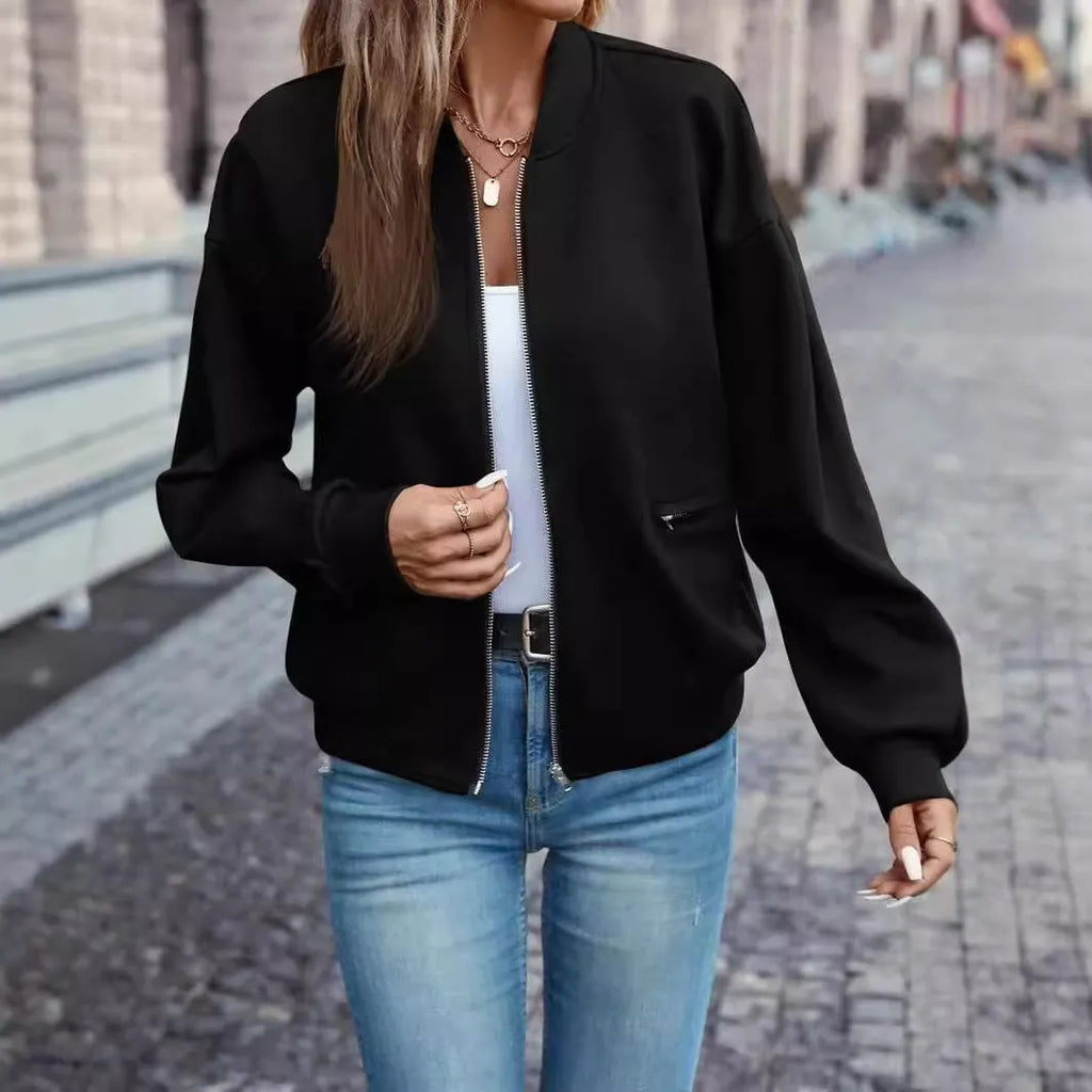 Women's black casual zip jacket with long sleeves and faux pocket detail