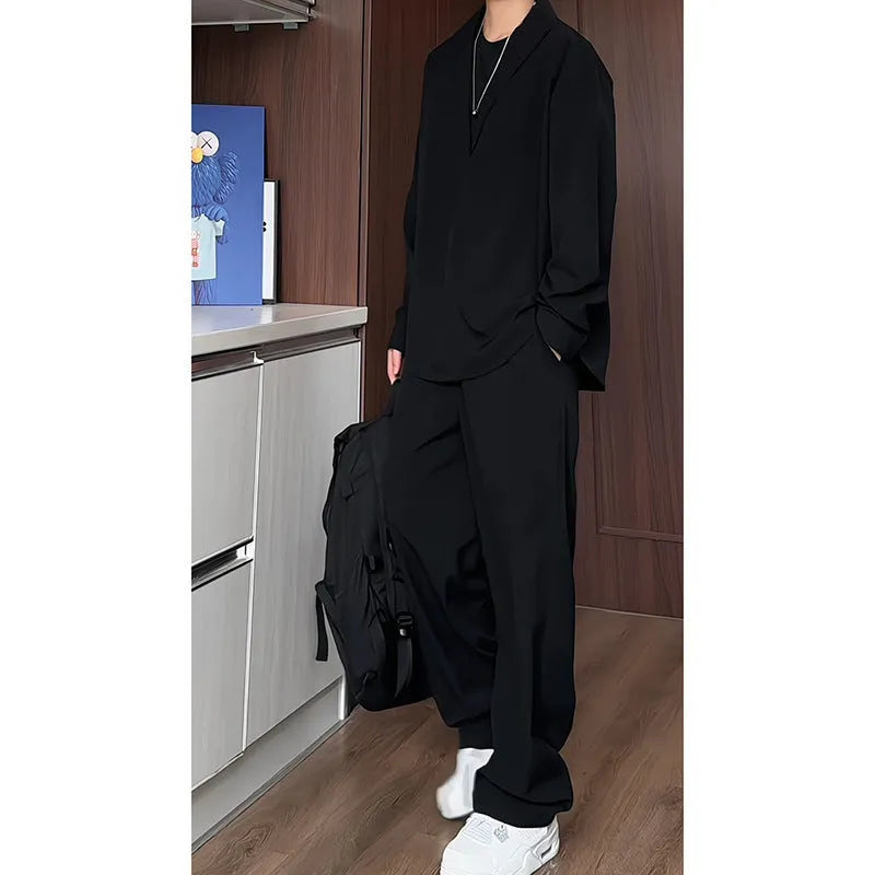 Men's black casual hemp polo shirt and trousers two-piece suit set on a hanger.