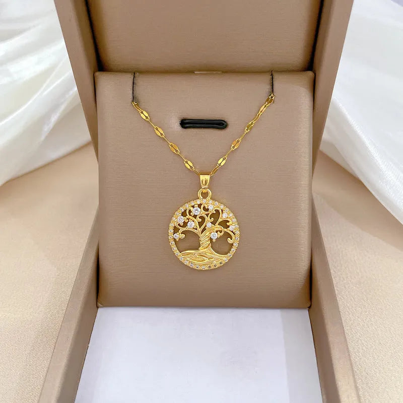 Gold plated Lucky Tree necklace with mother of pearl pendant and rhinestone zircon detail on a lip chain.