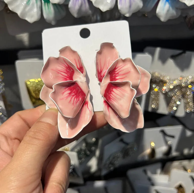 Women's alloy floral stud earrings with oil-spot glaze finish in blue, green, purple, and rose colour options