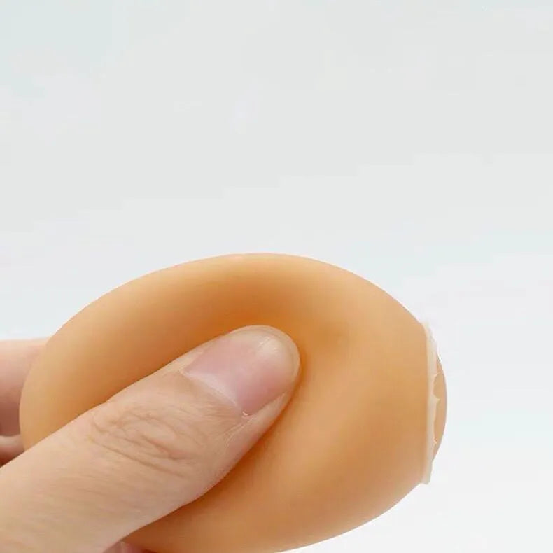 Egg-shaped dog squeaky toy for dental cleaning with sound mechanism