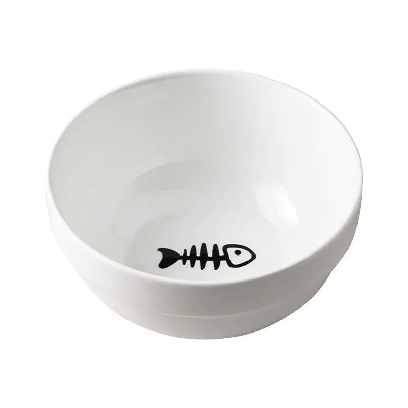 White ceramic pet bowl with cat paw design on a black metal stand with cat ear details.
